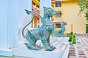 The singha lion-guardians at Phra Vihara Somdej, Wat Benchamabophit Dusitvanaram Marble Temple, Bangkok, Thailand