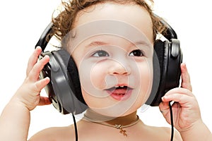 Singing baby wearing headphones