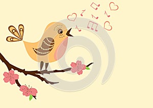Singing bird on a blossoming branch.