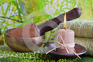 Singing bowl and a candle - spa decoration