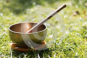 Singing bowl in the own garden, zen outdoors photo