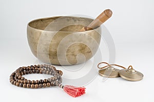 Singing Bowl, Prayer Beads and Meditation Bells.