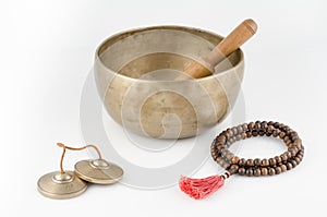 Singing Bowl, Prayer Beads and Meditation Bells.