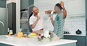 Singing, dancing and young black couple in kitchen listening to music, radio or playlist at apartment. Happy, love and