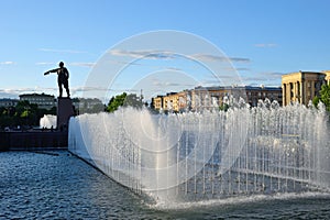 Singing fountains on Moscow square on the background of the monument to Lenin on a Sunny summer day in St. Petersburg