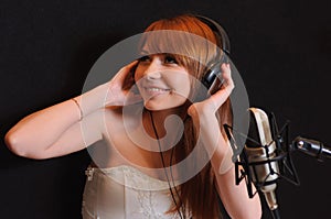 Singing girl in headphones.