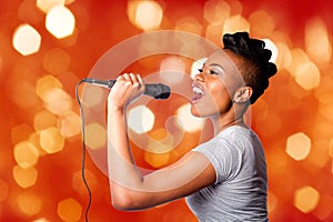 Singing karaoke woman with microphone photo