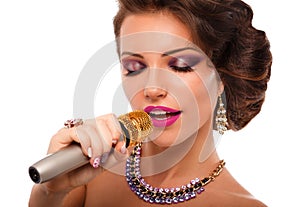 Singing Woman with Microphone.Glamour Singer Girl Portrait. Karaoke Song