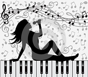 Singing woman sitting on the piano keys
