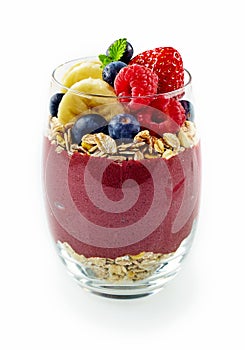 Single acai dessert glass of berries and oats photo