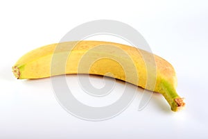 Single banana against white background