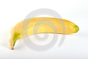 Single banana against white background