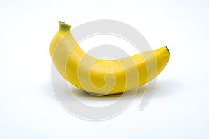 Single banana isolated on white background.