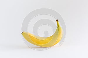 A single banana on a white background, with copy space