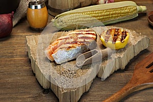 Single BBQ Grilled Salmon Steak On The Wood Board