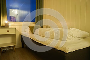 Single bed in small bedroom in hostel for rest