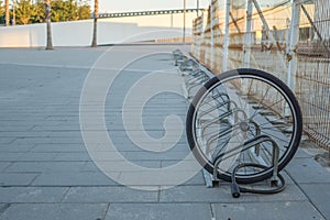 a single bicycle wheel on the street due to stealing