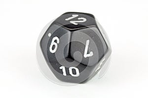 Single, black 12-sided die on white