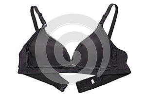 A single black brassiere against a white backdrop