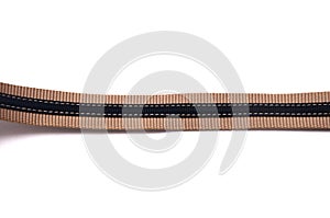 A single blue canvas material fabric belt strap against a white backdrop