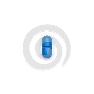 Single blue pill isolated on white background. Medication and prescription pill minimal flat lay.