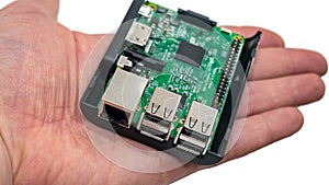 Miniature computer on the palm of hand.