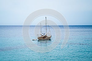 Single Boat on calm sea no clouds