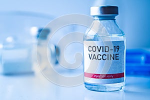 A single bottle vial of Covid-19 vaccine. Medical concept vaccination hypodermic injection treatment. Vaccine and syringe injectio