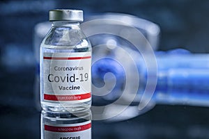 A single bottle vial of Covid-19 vaccine. Medical concept vaccination hypodermic injection treatment. Vaccine and syringe injectio