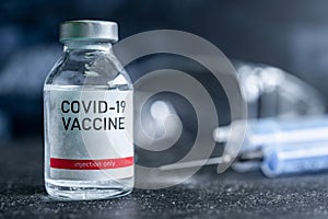 A single bottle vial of Covid-19 vaccine. Medical concept vaccination hypodermic injection treatment. Vaccine and syringe injectio