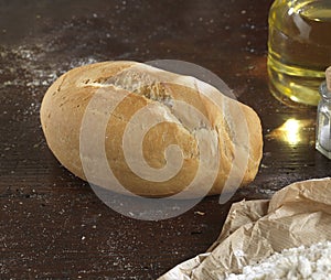 Single bread on a rustic wooden countertop natural food photo