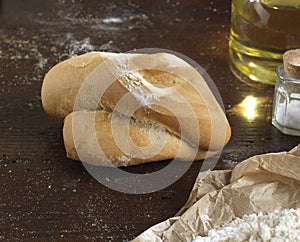 Single bread on a rustic wooden countertop natural food and ingredients , photo