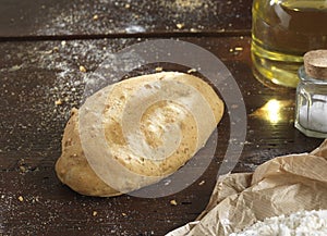 Single bread on a rustic wooden countertop photo
