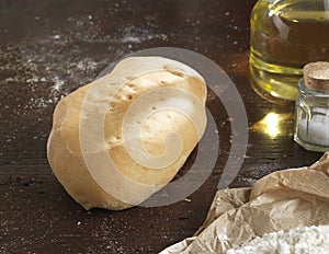 Single bread on a rustic wooden countertop photo