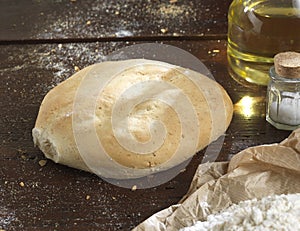 Single bread on a rustic wooden countertop photo