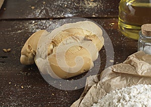 Single bread on a rustic wooden countertop , photo