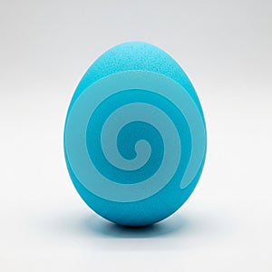 Single Bright Blue Easter Egg on a White Background vibrant