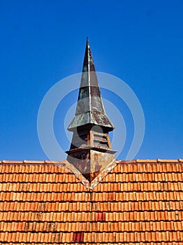 Small Church Spire on Terracotta Tile Roof