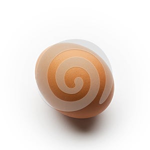 Single brown egg isolated on a white background.