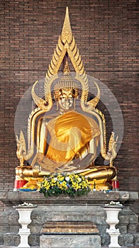 Single Buddha statue inside Wat Yai Chai Mongkhon, a Buddhist temple of archaeological park photo