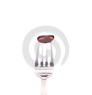 Single canned bean on fork.