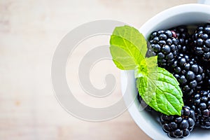 Single cap filled with fresh blackberries