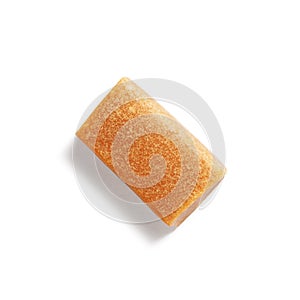 Single caramel candy on white, isolated