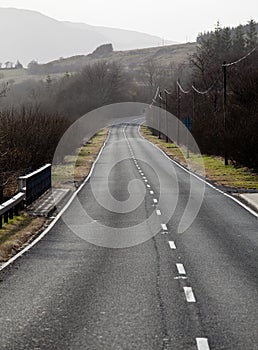 Single carriageway road into distance