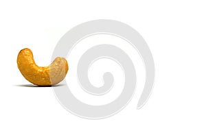 Single Cashew nut isolated white background - with copy space - healthy food concept