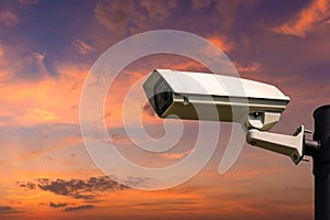 Single CCTV Security camera on beautiful sunrise sky