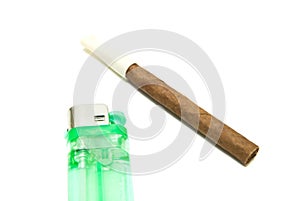 Single cigarillo and lighter on white
