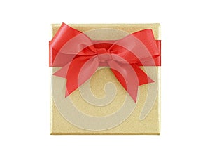 single closed golden gift box with red ribbon bow isolated on white background