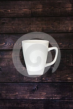 Single coffee mug on a wooden table background - java espresso with copy space