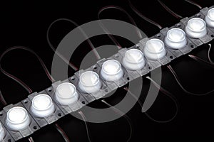 Single cold white led module on black background